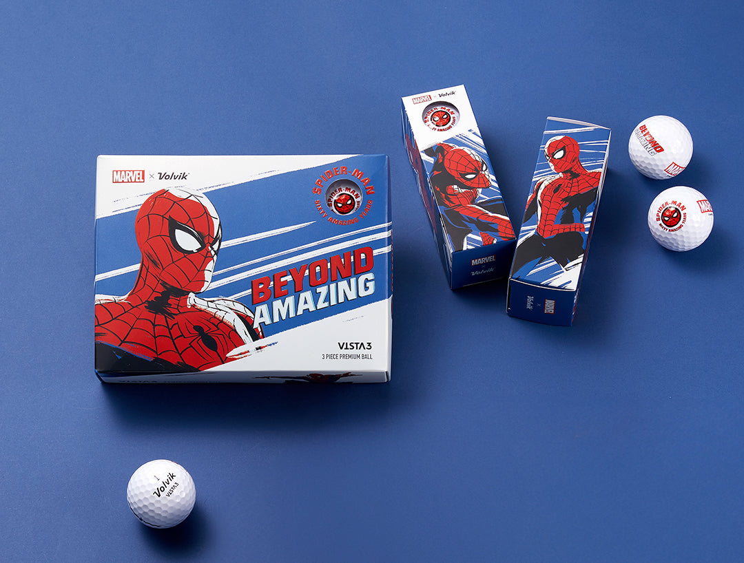 A set of golf balls with Spider Man design on the packaging, along with the text 'Beyond Amazing'. The packaging is blue and red, reflecting the Spider Man theme.