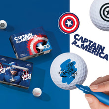 A collection of golf balls with Captain America designs, including a box of balls with the Captain America logo and a hand holding a pen with a Captain America pattern.